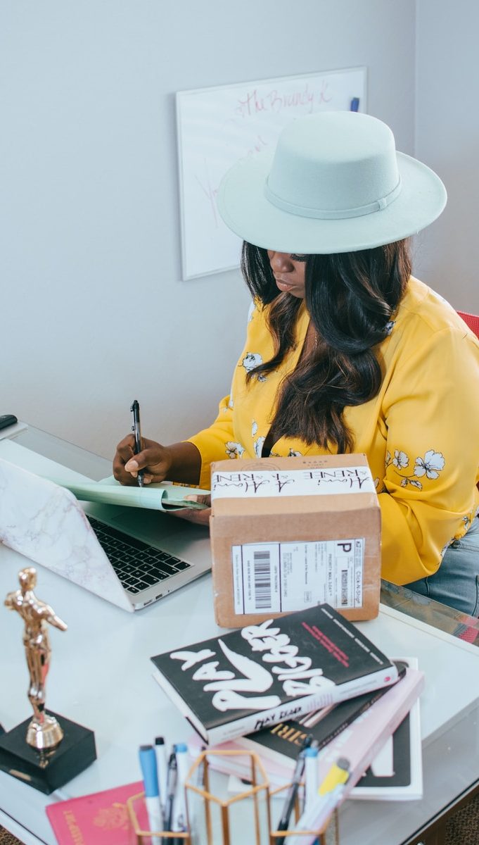 woman in yellow long sleeve shirt wearing white cowboy hat